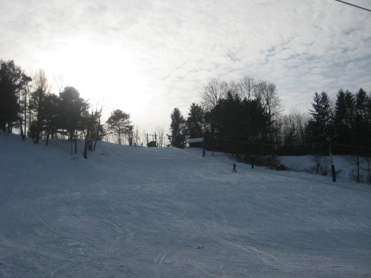 Base of the ski area, looking up at the intermediate slope and tow.