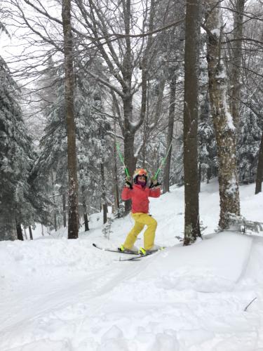 Milana celebrating in the woods